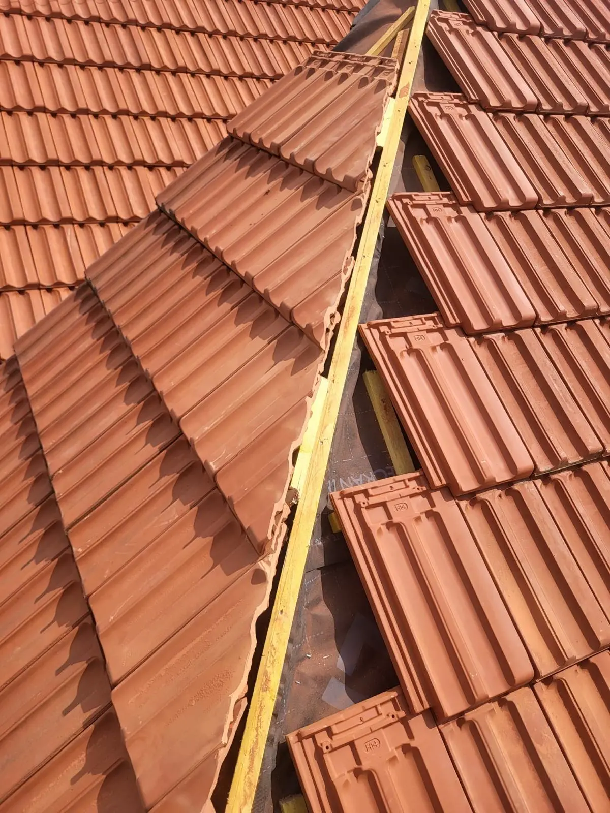 Historic roof renovation with flat tiles